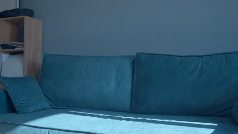 teal sofa in a modern living room