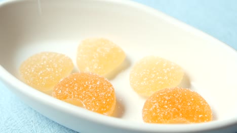 assorted gummy candies in a white bowl