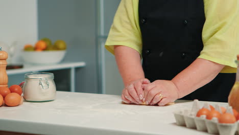 Grandmother-hands-preparing-homemade-cookies