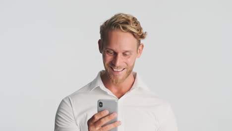 Blond-businessman-using-smartphone