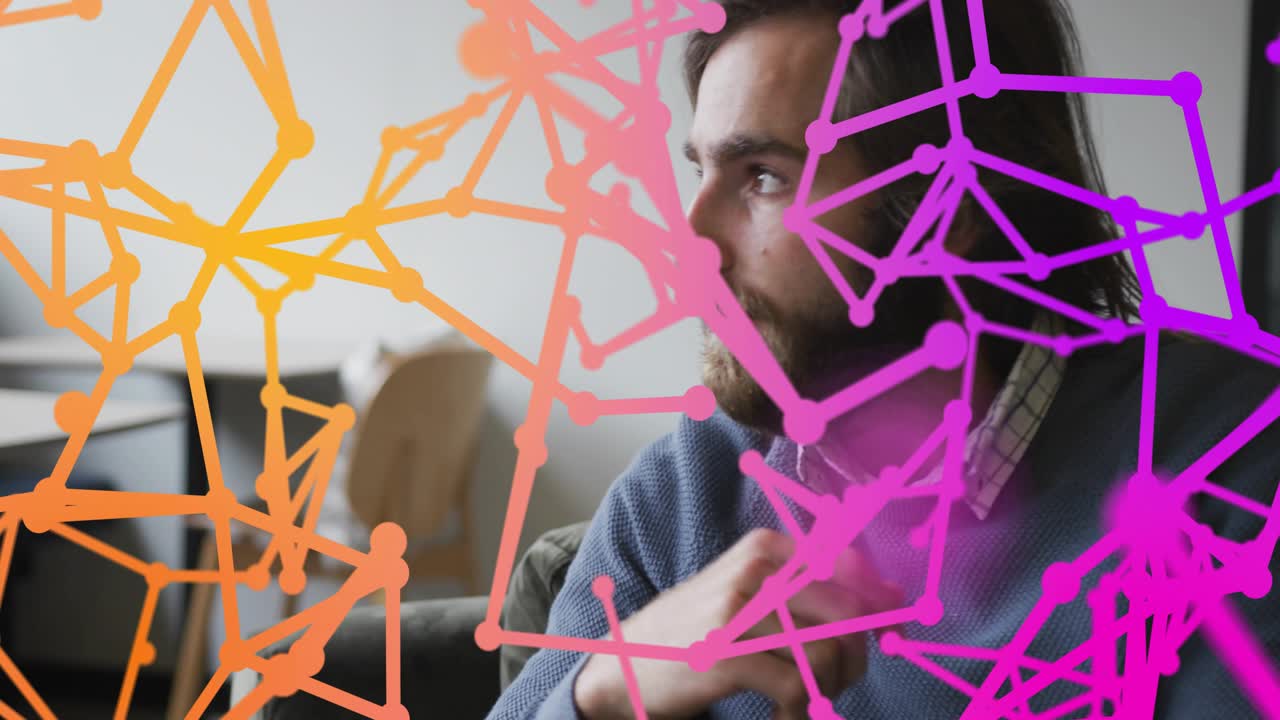 Man pausing and pondering digital particles forming expanding dissolving network in technology demo