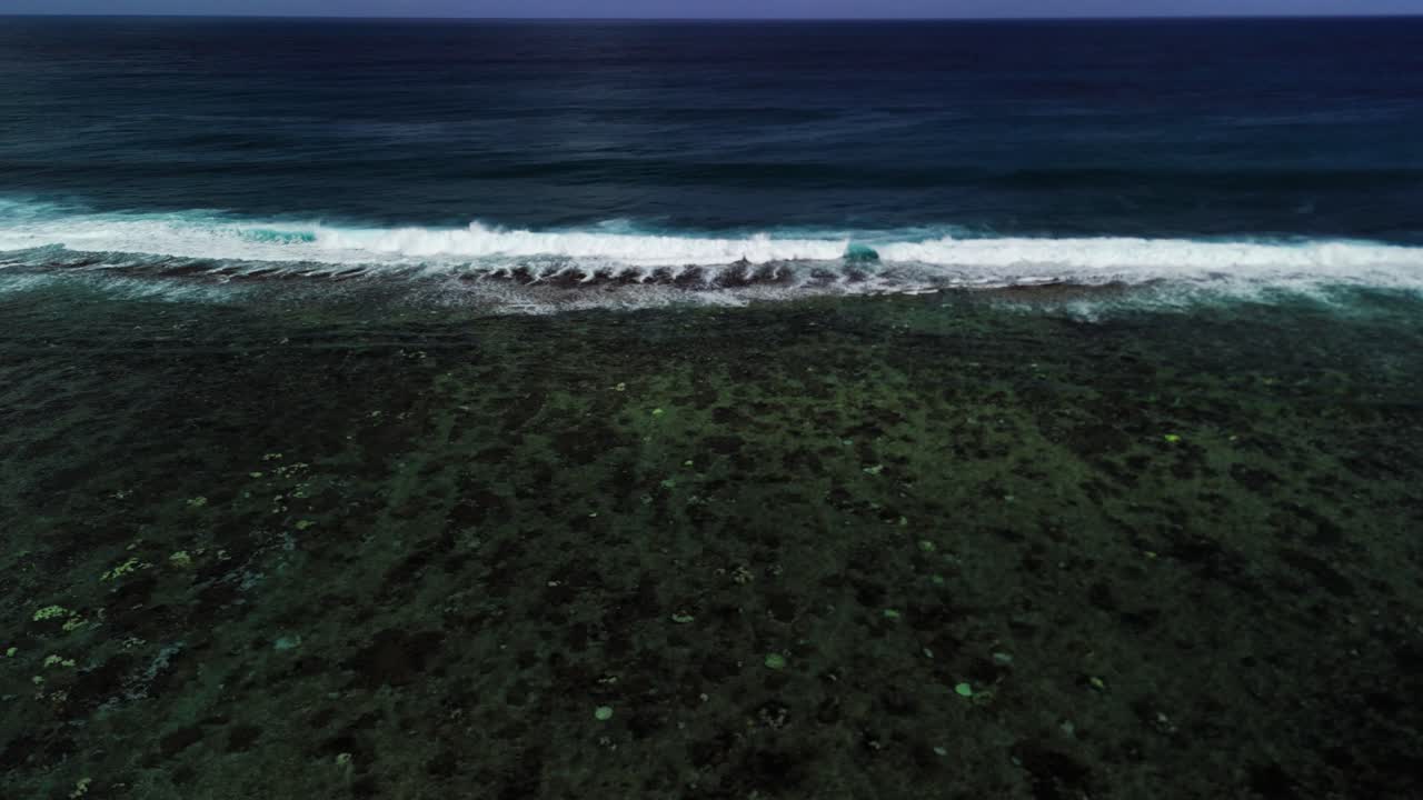 Rolling waves crash over shallow reef waters at St. Felix Beach, Mauritius. A raw and moody capture of nature’s coastal rhythm.