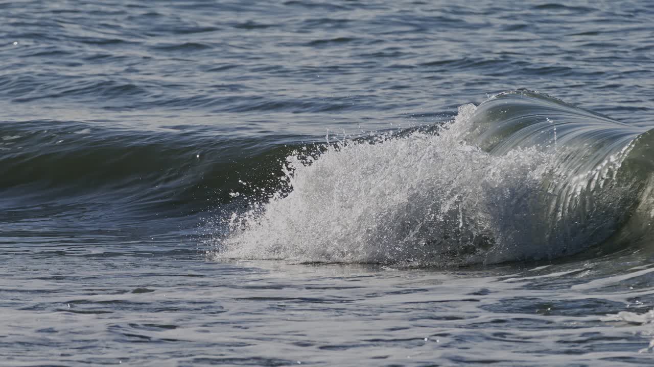 Rolling wave in slow motion near Oosterschelde Storm Surge Barrier in Zeeland, NL
