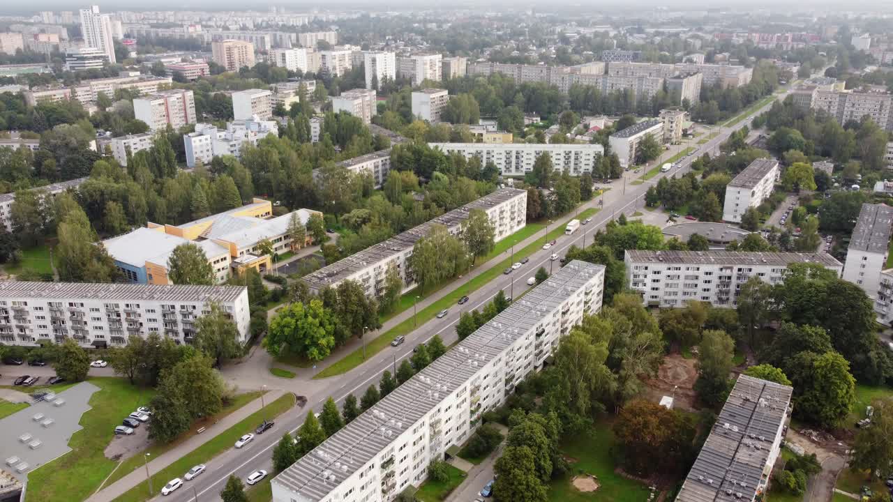 Urban area with streets and multi-story apartment buildings, aerial view