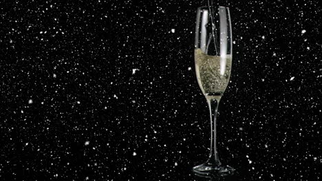 Animation-of-confetti-falling-over-champagne-glass