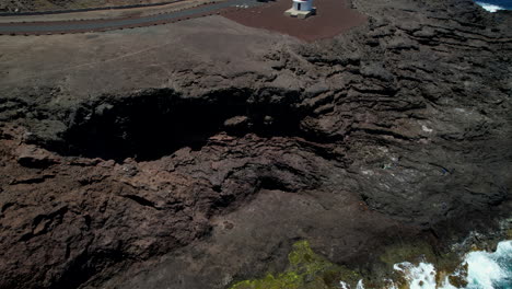 Aerial-shot-flying-towards-the-lighthouse-in-Gran-Canaria,-the-Spanish-island