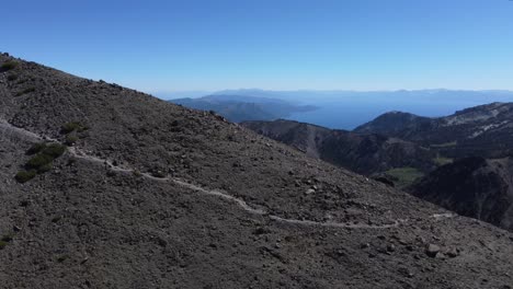 Aerial-reveal-shot-of-the-Lake-Tahoe-Basin-from-the-trail-leading-to-the-peak-of-Mount-Rose