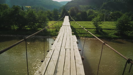 Tension-Rope-Bridge-With-Wooden-Decking-Over-The-Mountain-Stream