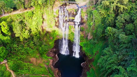 drone approach the taller waterfall in the pakse bolaven plateau laos motorcycle loop