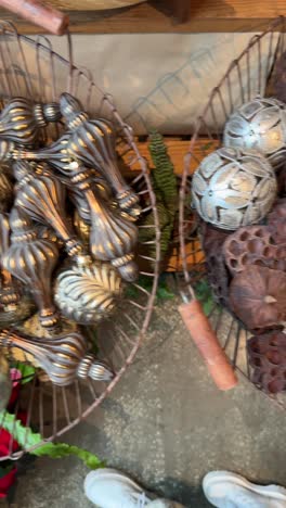 christmas ornaments and decorations in a basket