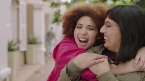 close up portrait of cute young girl suprise hugging friend girlfriends laughing embracing enjoying togetherness lively urban youth