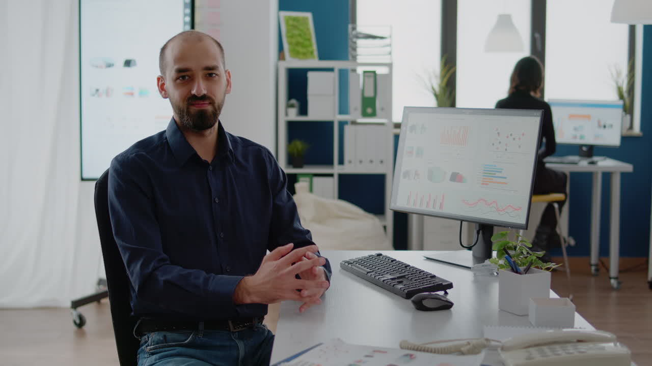 Portrait of businessman working on computer at office