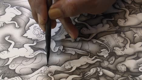 very talented artist is drawing beautiful patterns with a black ink pen