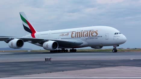 emirates airbus a380 on taxiway of nice cote d'azur airport in nice, france. closeup, tracking shot