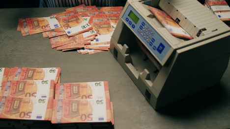 specialised police officer counting dollar banknotes in crime lab, conceptual image. high quality 4k footage