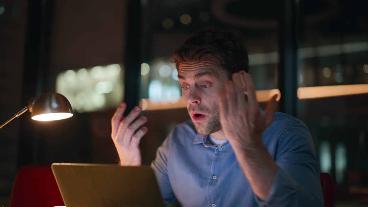Distant manager disappointed work problem at night apartment workplace closeup