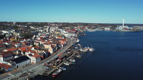aerial view of coastal town with harbor and boats
