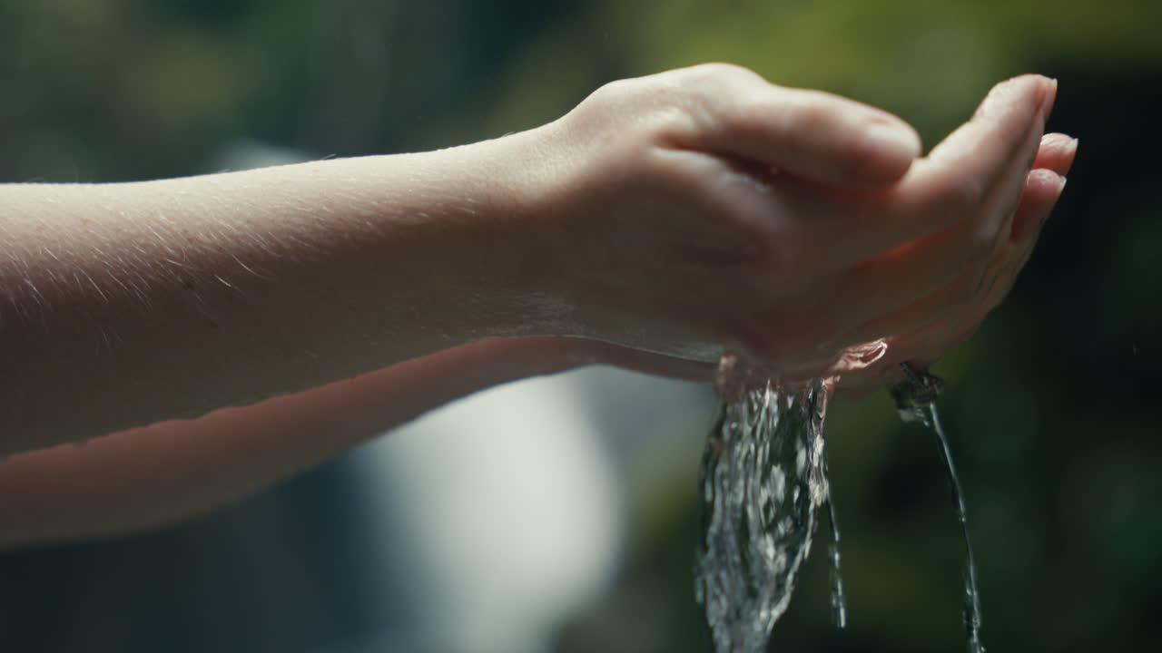 Hands holding water