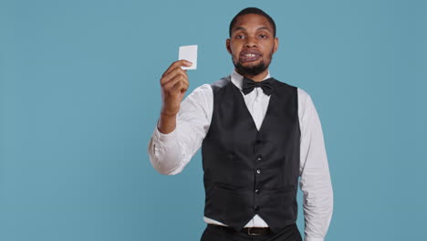 bellhop personnel offering access card to the room for guests