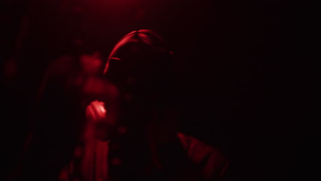 person in red light