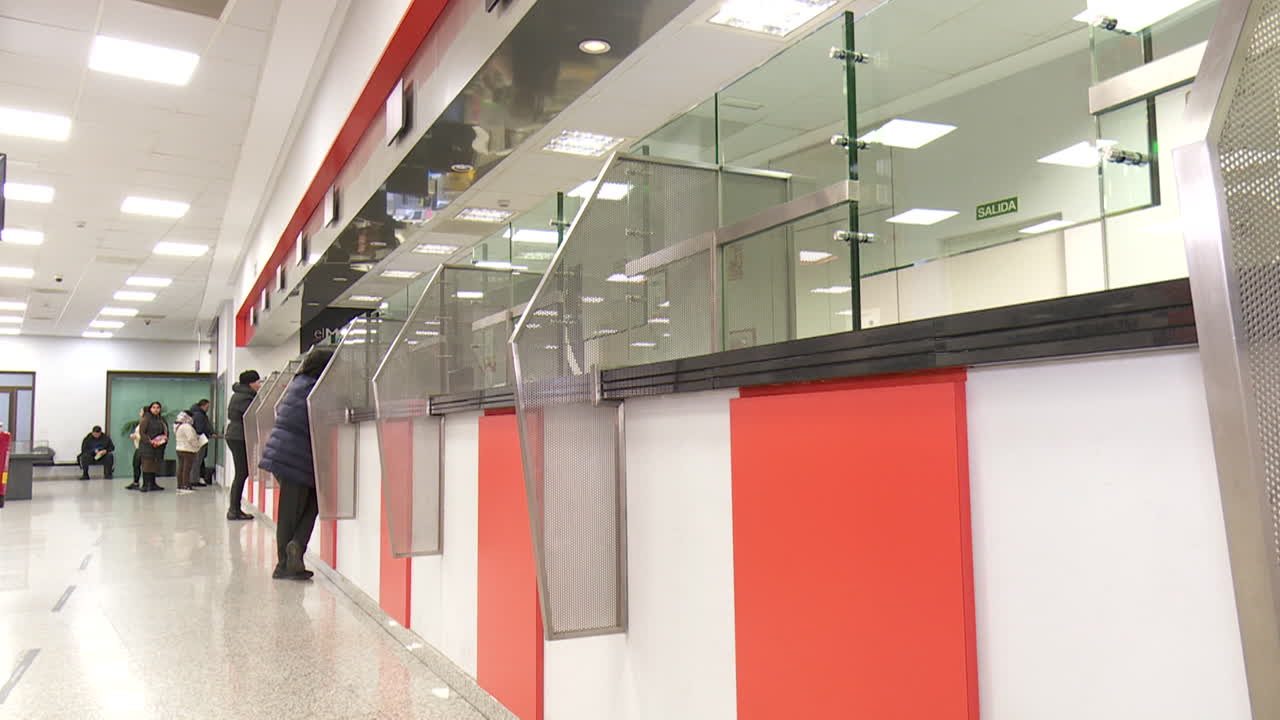 Public Building Interior with People Waiting in Line