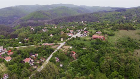 An-approaching-drone-shot-over-the-neighborhood-of-the-Tsarichina-Hole-Village,-a-place-known-for-some-extraterrestrial-activities-in-Bulgaria