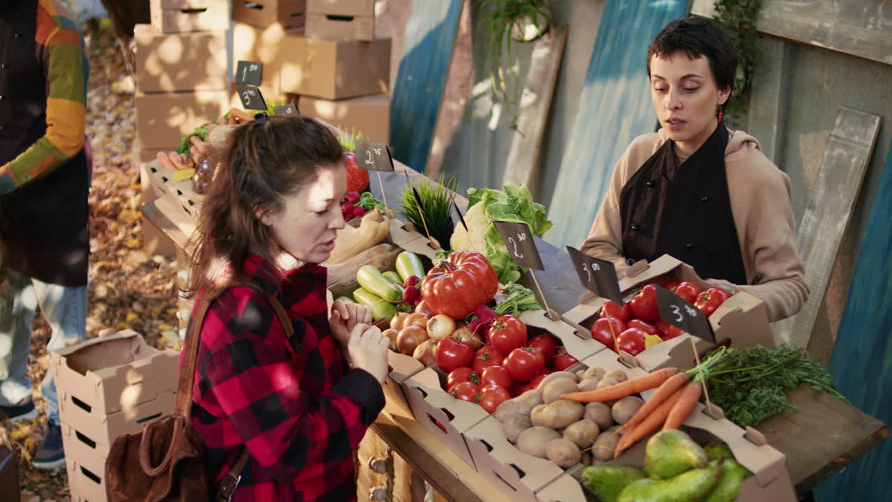 People Shopping for Vegetables at a Farmers Market