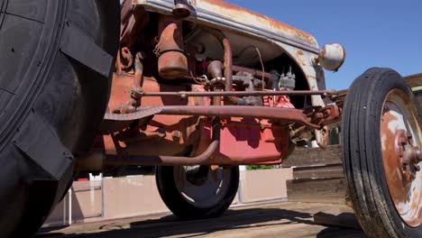 Looking-at-the-engine-from-the-underside-of-an-antique-tractor---sliding-view