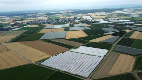 aerial view of agricultural fields and greenhouses