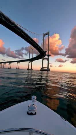 sunset view of a bridge from a boat