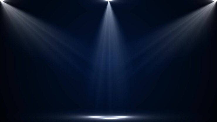 Dark blue stage spotlight background with soft overhead beams clean empty space and cinematic floor