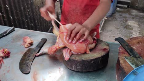 Butcher-separates-pieces-of-raw-chicken-for-sale-at-the-wet-market-in-India