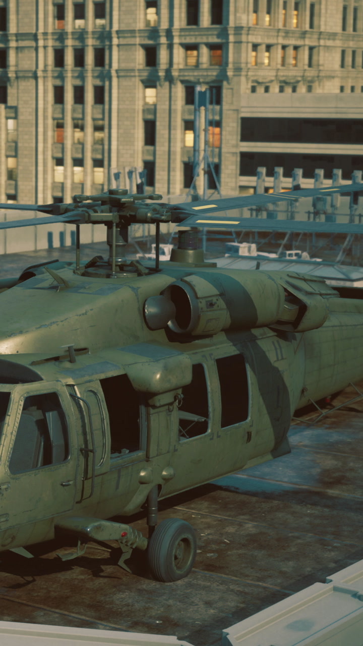 Military helicopter on a rooftop near city buildings during daylight hours