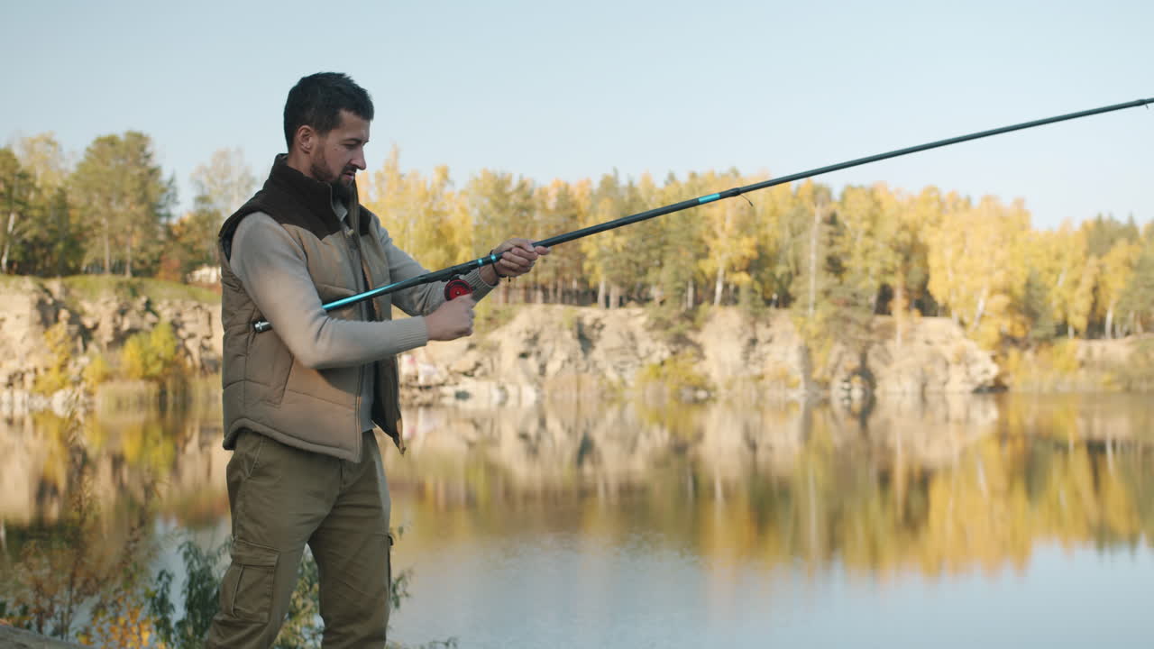 Man Fishing in Autumn Quarry