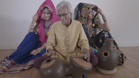 indian percussion musician with dancers 10