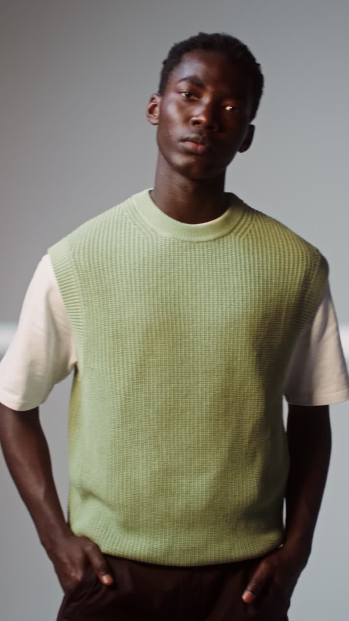 Man in sweater vest and T-shirt