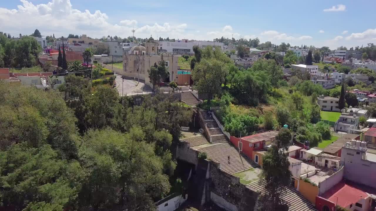 Aerial footage of the Ex Convento de San Francisco in Tlaxcala, Mexico, highlighting its colonial architecture and historic significance