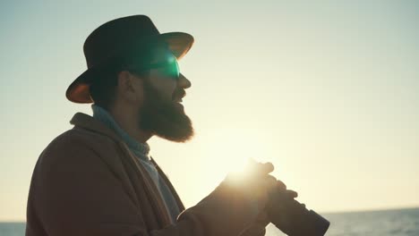 photographer capturing sunset at the beach