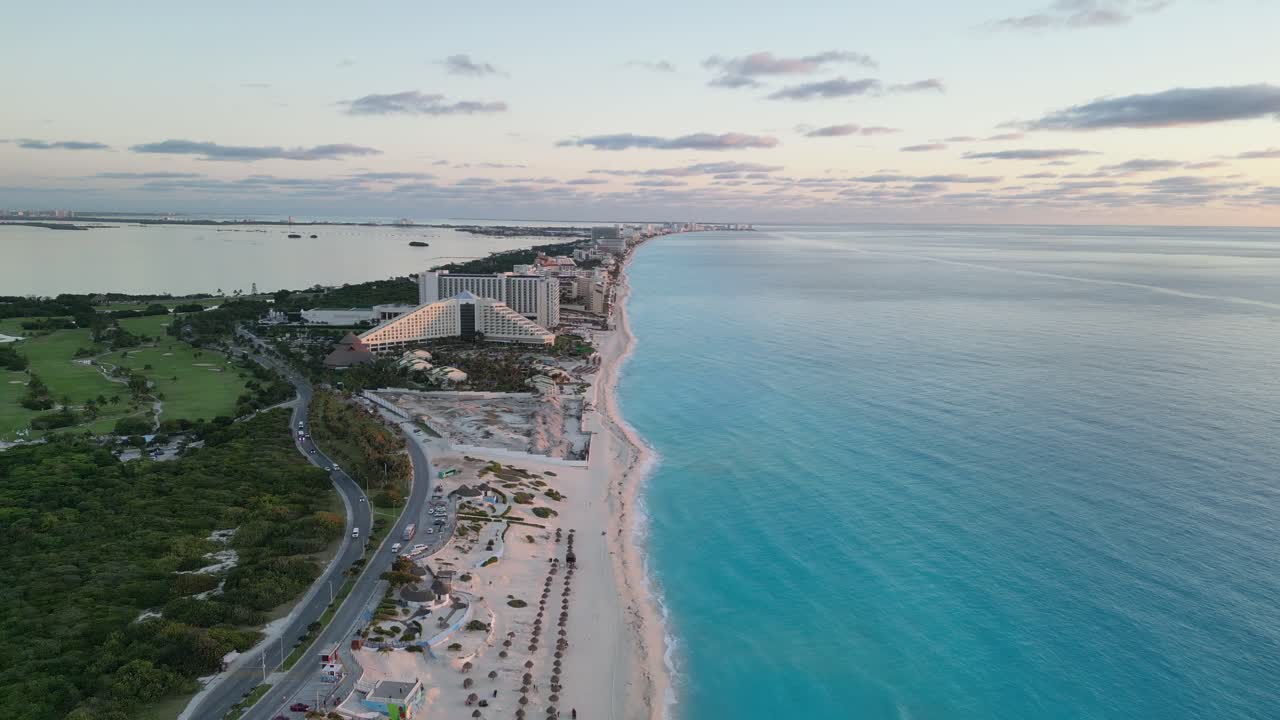 Beautiful aerial view of Cancun beach, showing hotels and turquoise water at sunset, playa delfines