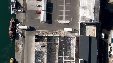 Aerial-View-of-Abandoned-Buildings-near-the-water-Hout-Bay-Harbor-South-Africa