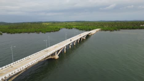 4k drone video flying along catangnan bridge on siargao island in the philippines