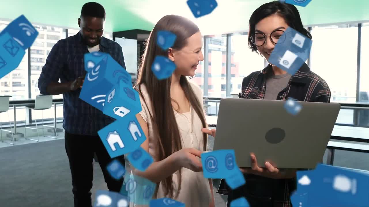 디지털 아이콘이 노트북을 사용하는 사무실 동료들에게 떨어지고 있습니다.