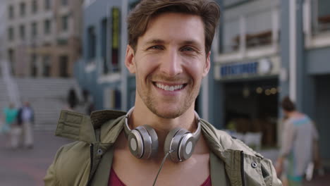 portrait-of-cheerful-attractive-young-man-laughing-happy-at-camera-in-busy-urban-background