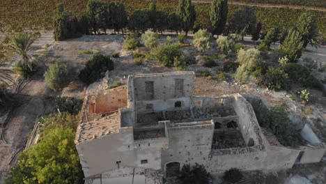 Flying-over-abandoned-farm-with-vineyards-at-Sicily-italy,-aerial