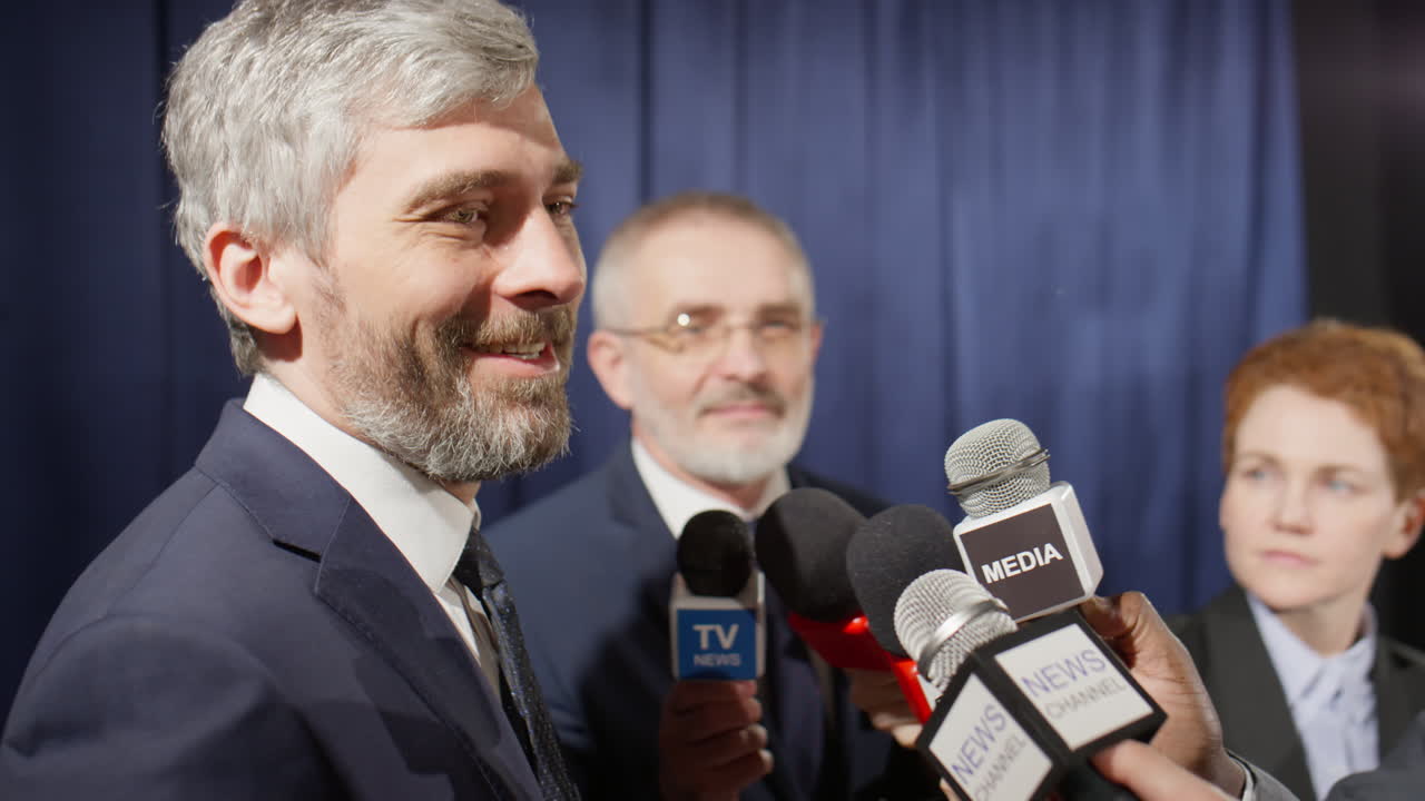 Politician Giving Interview to Group of Journalists