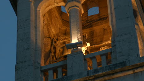 illuminated bell tower at dusk