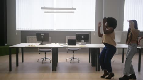 multinational employees go in single file dancing in office