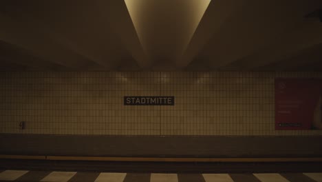 underground subway driving into station in berlin, germany with no people passengers during covid 19 corona virus pandemic