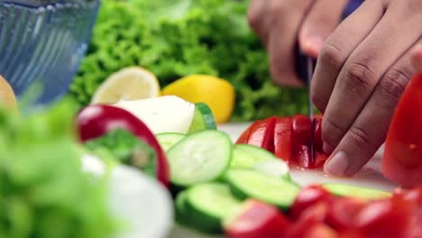 Man-Making-Salad-In-Kitchen-2