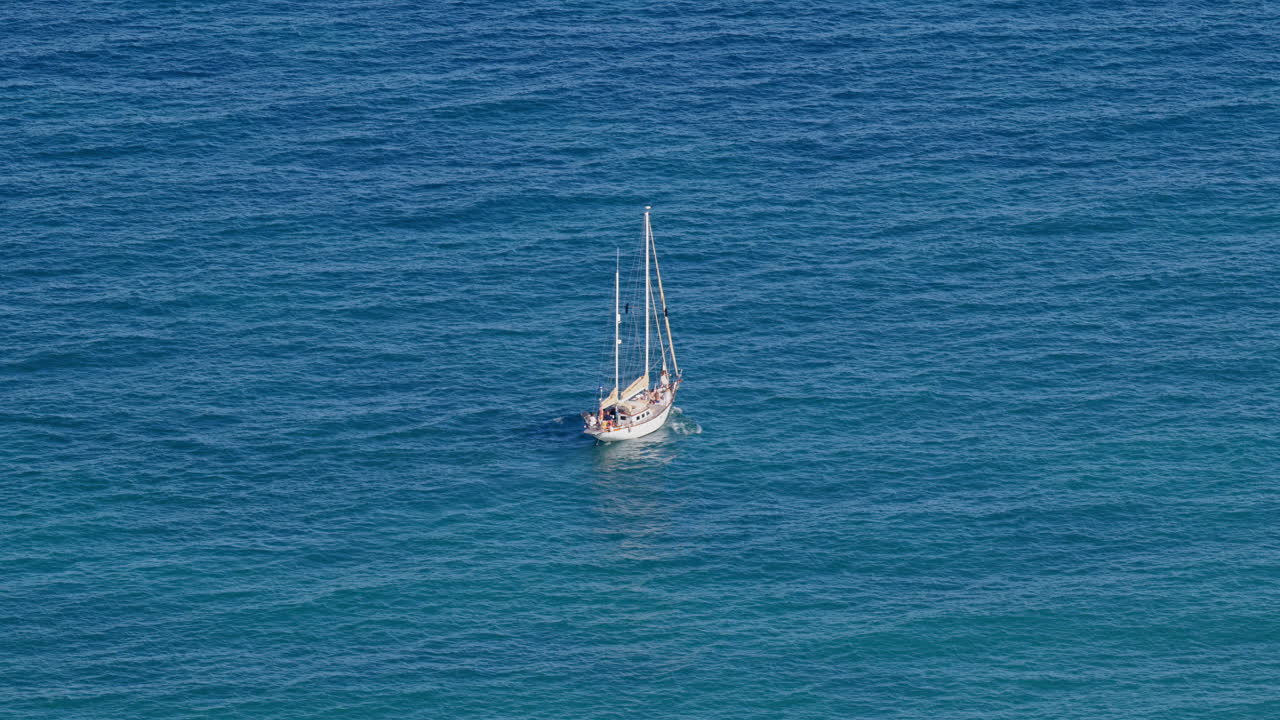 Lone yacht on calm blue water off Alicante, Spain